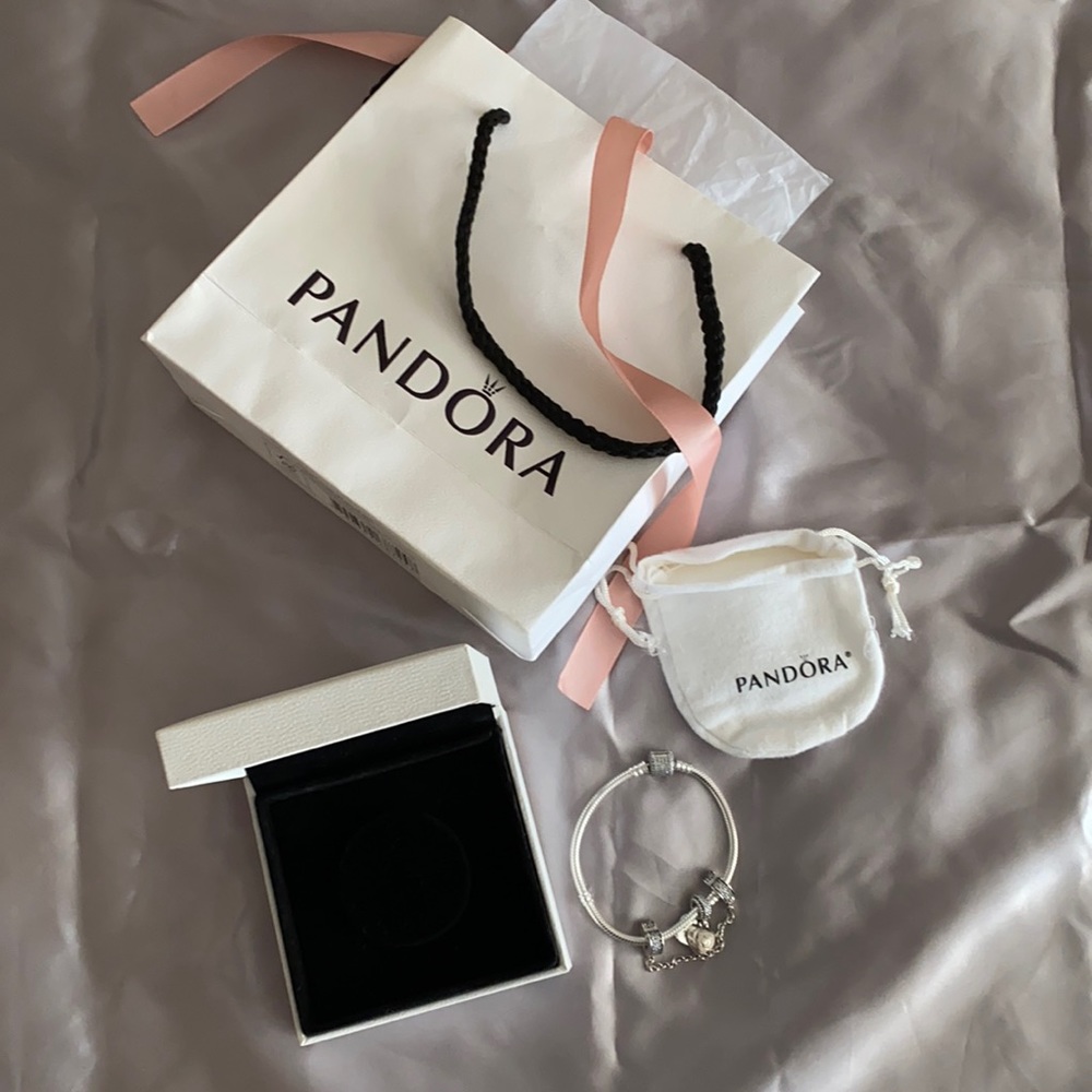 Pandora bracelet with charm and safety size 7.1 in.